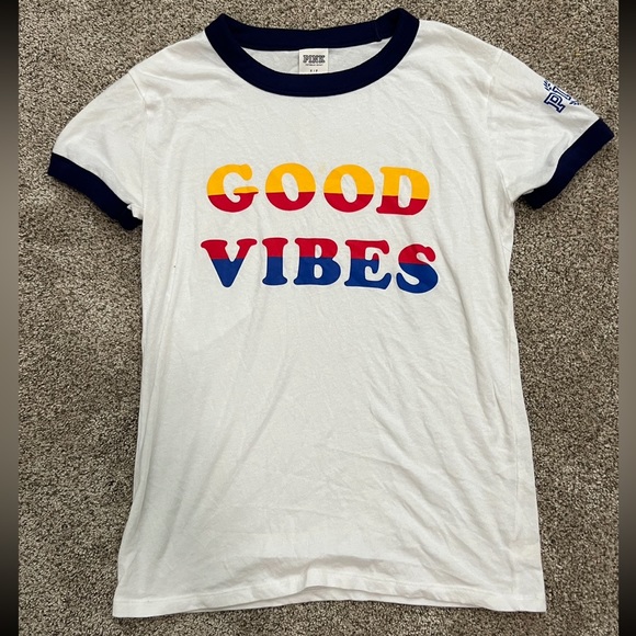 PINK Victoria's Secret Tops - Good vibes Victoria's Secret pink shirt • Worn once but has a stain